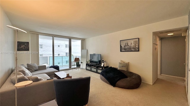 living room featuring expansive windows and light carpet