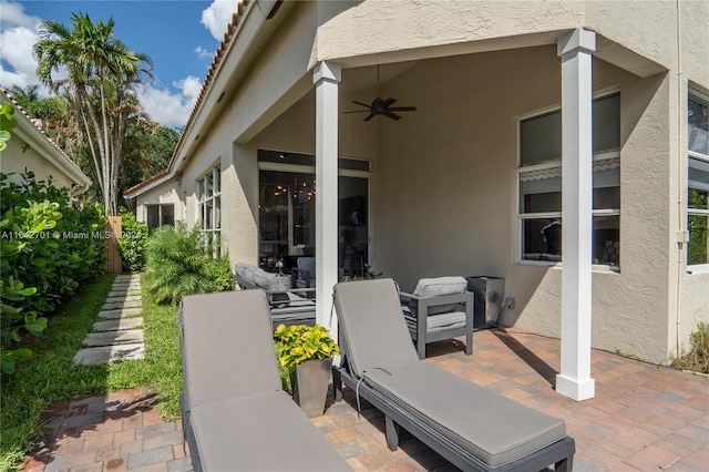 view of patio featuring ceiling fan