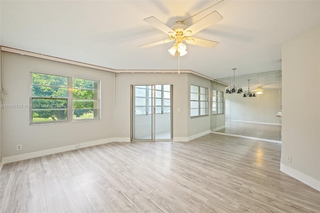 unfurnished room featuring light wood-type flooring and ceiling fan