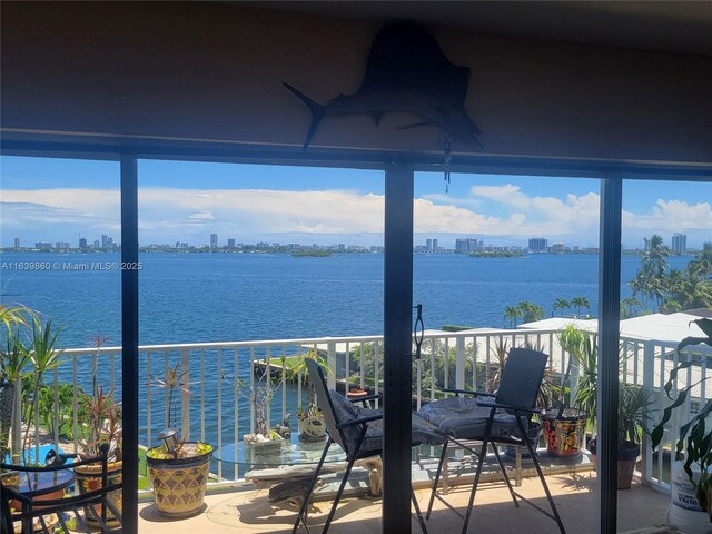 balcony featuring a water view