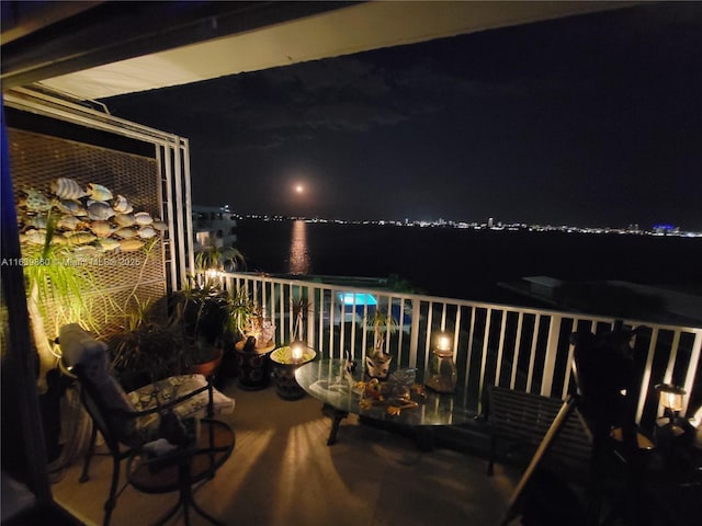 balcony at twilight with a water view