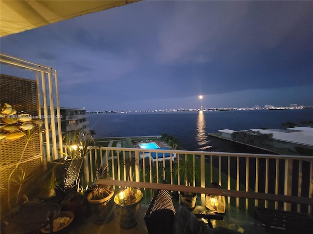 balcony featuring a water view