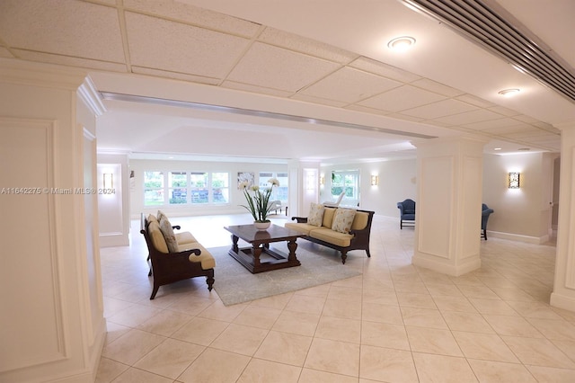 tiled living room with a drop ceiling