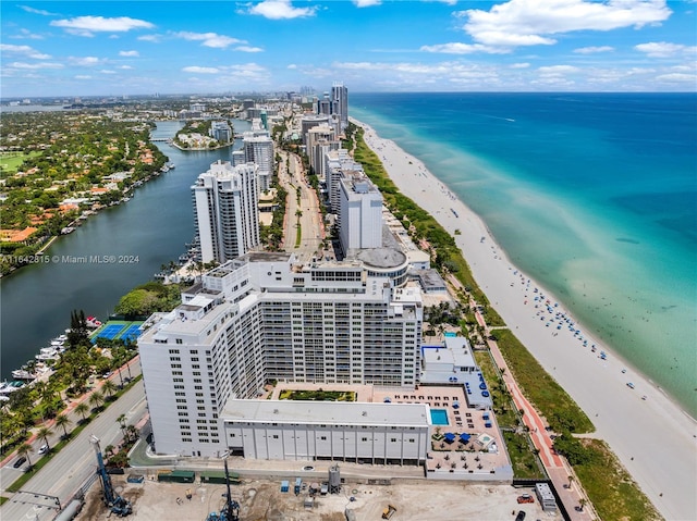 drone / aerial view featuring a view of the beach and a water view