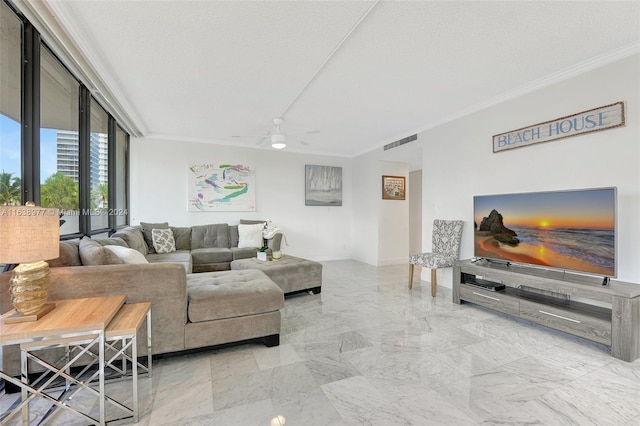 living room featuring ceiling fan and a textured ceiling