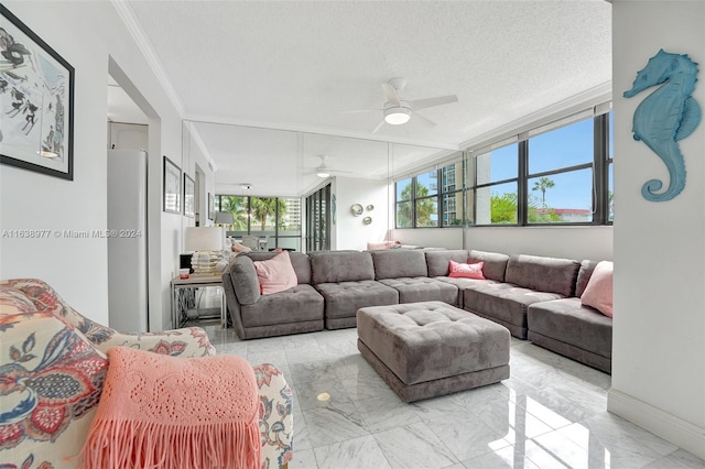 living room with crown molding, a textured ceiling, and ceiling fan