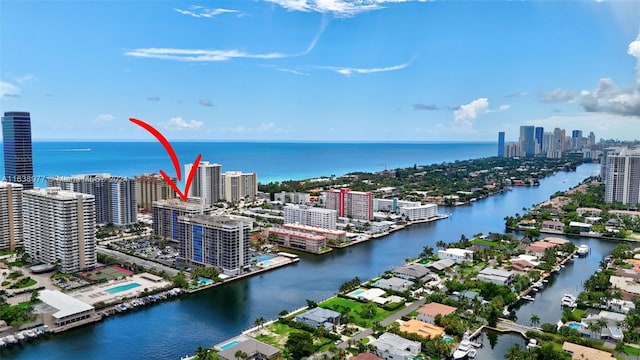 birds eye view of property with a water view