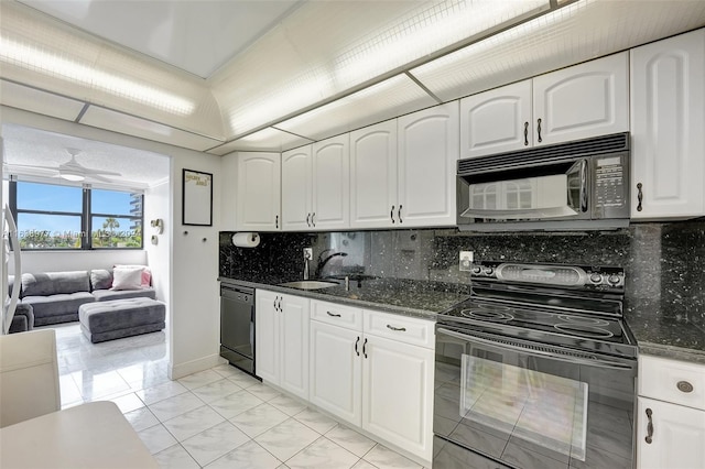 kitchen with black appliances, ceiling fan, white cabinetry, and sink