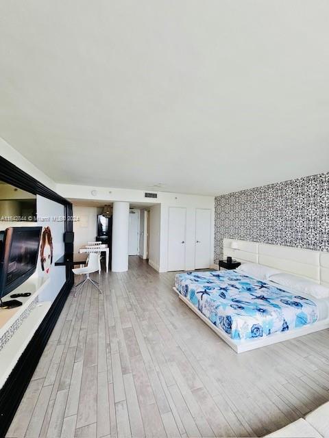 bedroom with light hardwood / wood-style floors