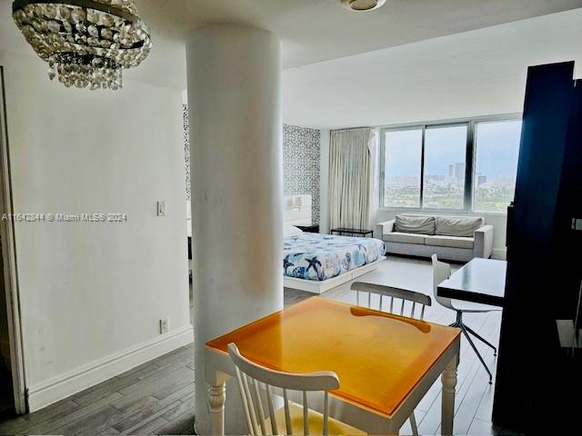 interior space featuring hardwood / wood-style flooring and a chandelier