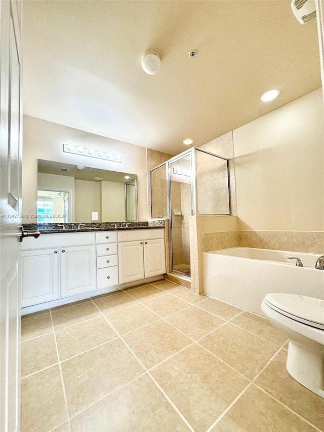 full bathroom with plus walk in shower, tile patterned flooring, vanity, and toilet