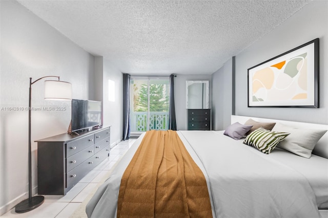 tiled bedroom featuring floor to ceiling windows and a textured ceiling