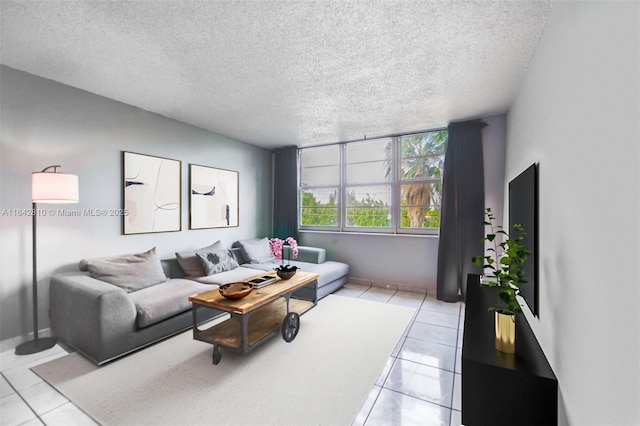 living room with light tile patterned flooring and a textured ceiling