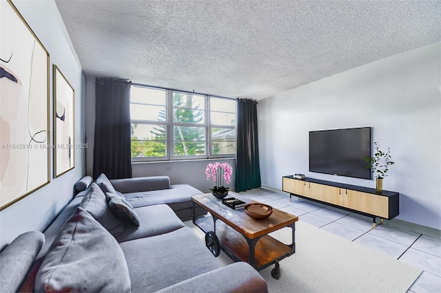 living room with light tile patterned flooring and a textured ceiling