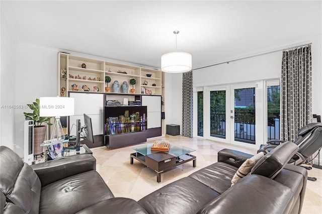 living area with ornamental molding and french doors