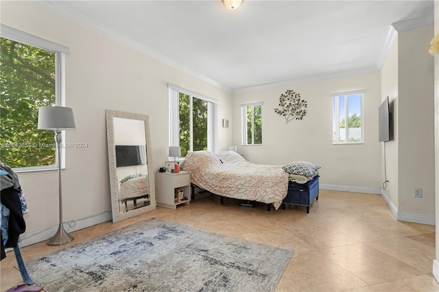 bedroom with ornamental molding and light tile patterned floors