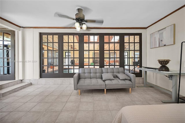 sitting room with ceiling fan, ornamental molding, and light tile patterned floors