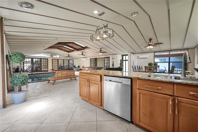 kitchen featuring ceiling fan, a wall unit AC, dishwasher, light tile patterned floors, and sink