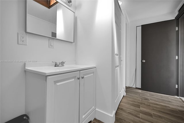 bathroom featuring hardwood / wood-style flooring and vanity