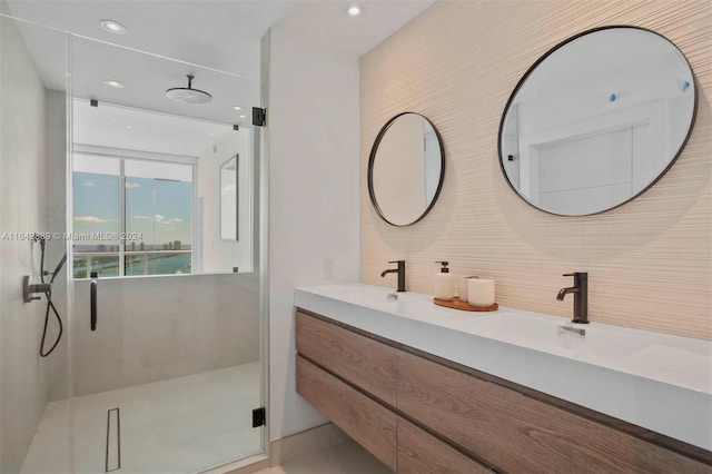 bathroom featuring double sink vanity, decorative backsplash, and a shower with shower door