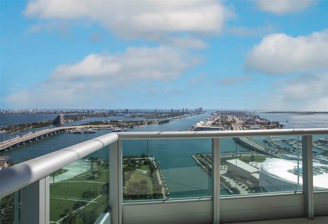 balcony featuring a water view