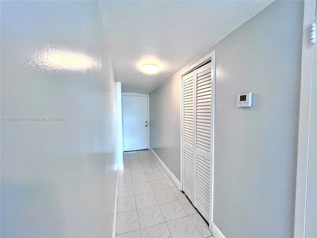 hallway featuring light tile patterned floors