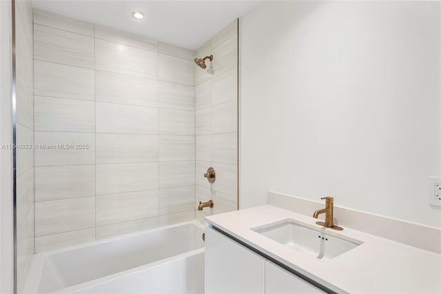 bathroom featuring vanity and tiled shower / bath combo