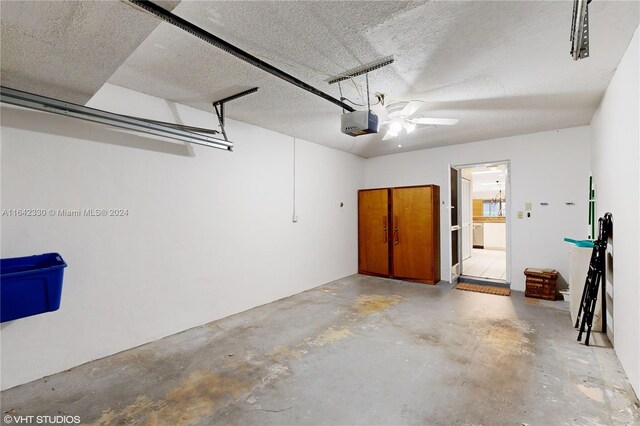 garage with ceiling fan and a garage door opener