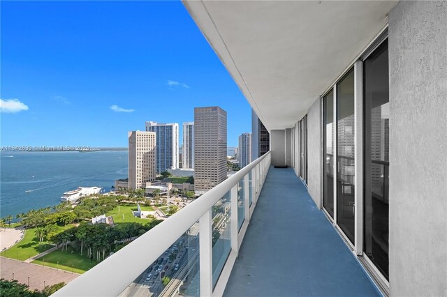 balcony featuring a water view