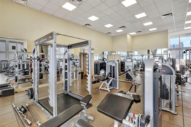 workout area with a paneled ceiling