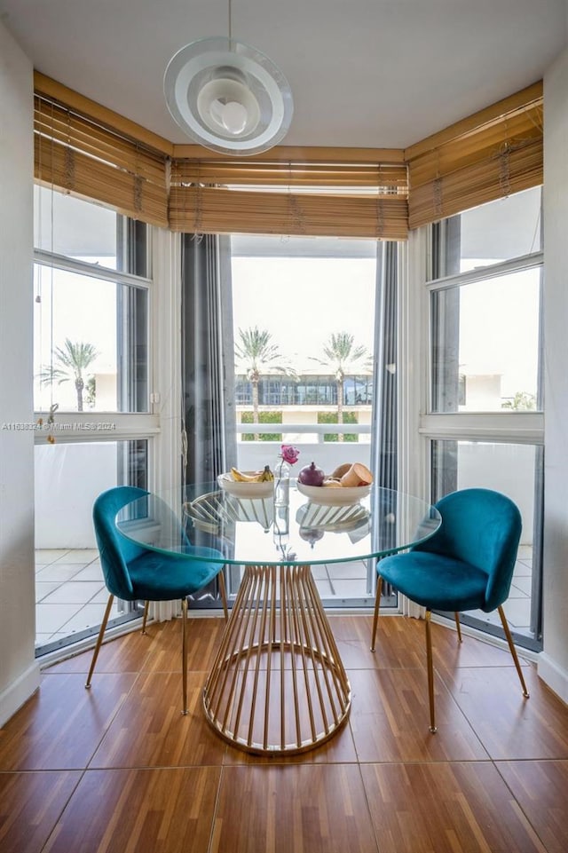 sunroom / solarium featuring breakfast area