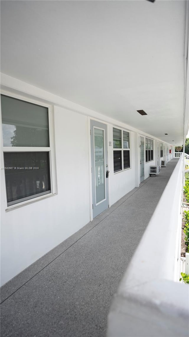 view of side of property with a balcony