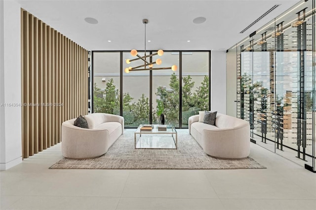 living room featuring a notable chandelier and floor to ceiling windows