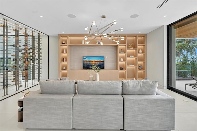 living room featuring a healthy amount of sunlight and an inviting chandelier