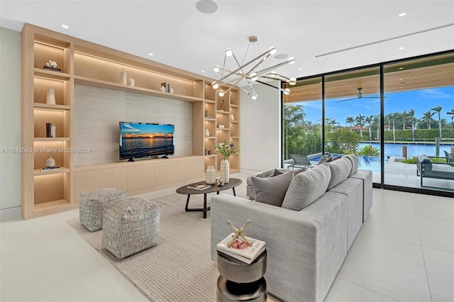 living room featuring a wall of windows, a chandelier, and built in shelves