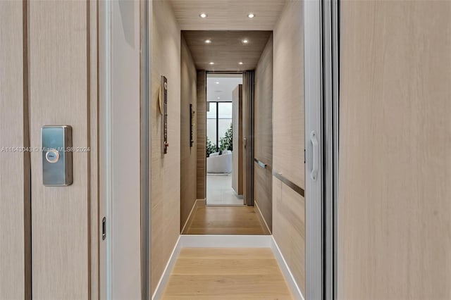 corridor featuring light hardwood / wood-style flooring