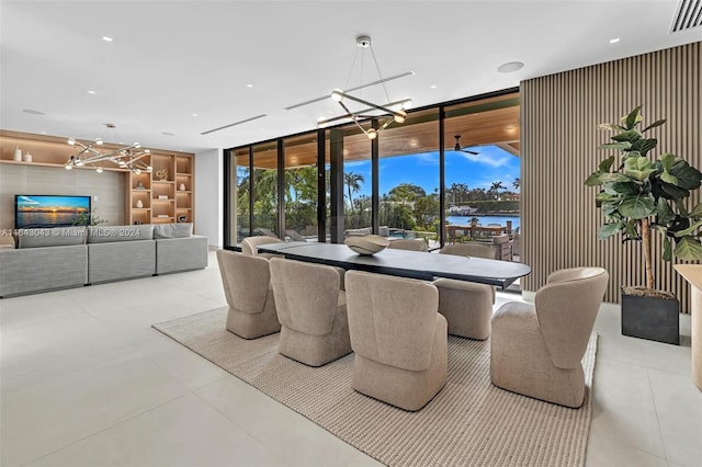 tiled dining space with expansive windows and an inviting chandelier