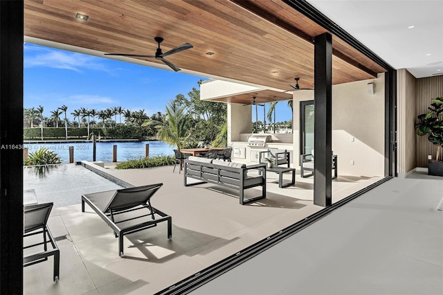 view of patio with ceiling fan, outdoor lounge area, and a water view