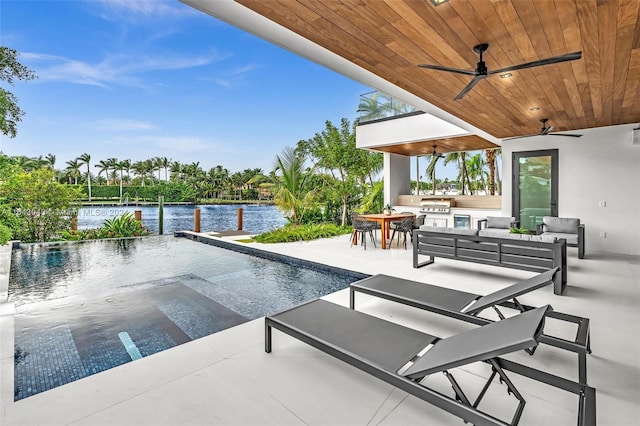 view of swimming pool with a water view, a patio area, a grill, ceiling fan, and an outdoor living space