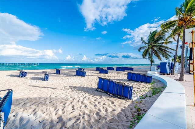 property view of water featuring a beach view