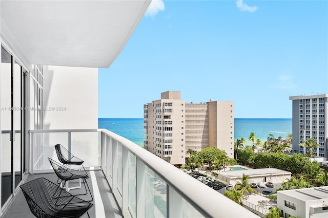 balcony featuring a water view