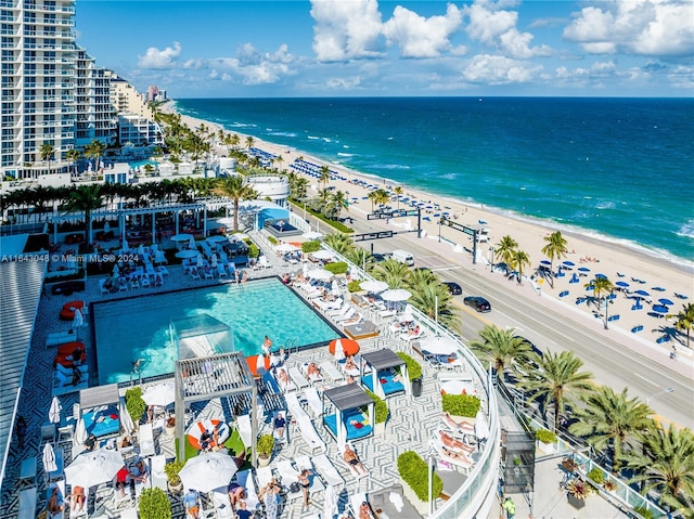 bird's eye view featuring a beach view and a water view