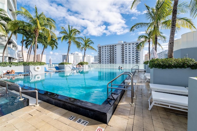 view of swimming pool featuring a patio area