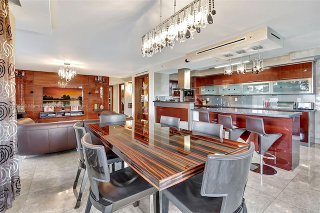 19667 Turnberry Way Unit 3E, Aventura, FL 33180 - dining space featuring wood walls, a toaster, and a chandelier