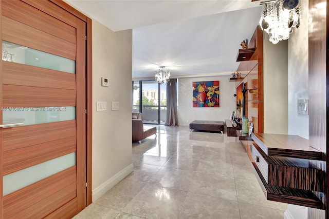 19667 Turnberry Way Unit 3E, Aventura, FL 33180 - hallway with light tile patterned flooring, a chandelier, and baseboards