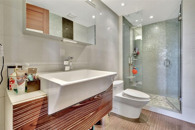 19667 Turnberry Way Unit 3E, Aventura, FL 33180 - full bath featuring a shower stall, tile walls, toilet, vanity, and visible vents