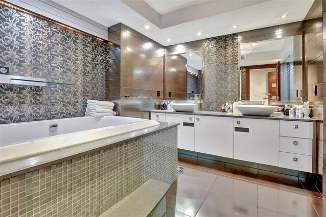 bathroom featuring tile walls, vanity, toilet, and tile patterned floors