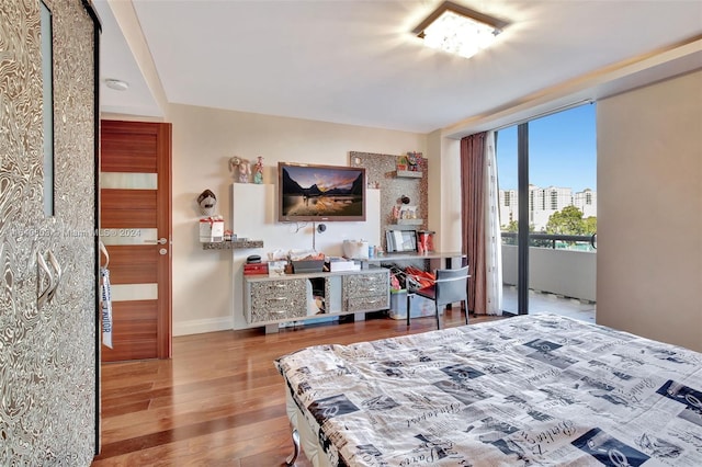 bedroom with hardwood / wood-style floors