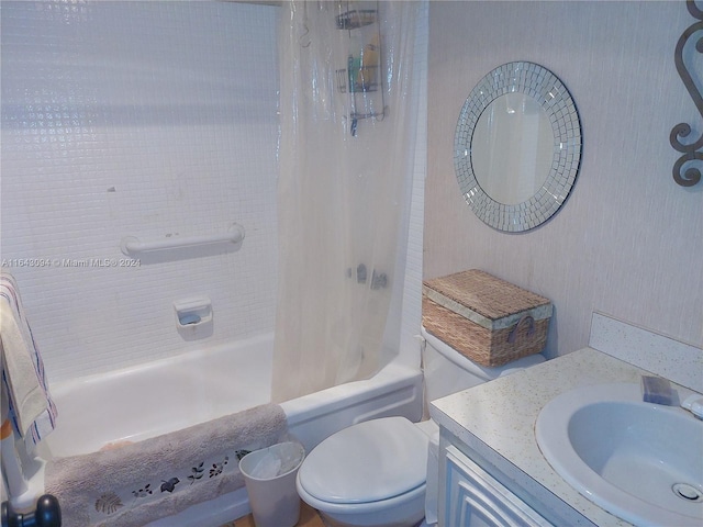 full bathroom featuring vanity, toilet, and shower / tub combo with curtain