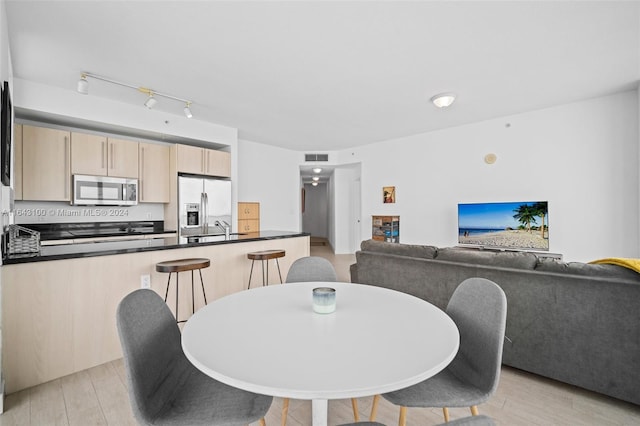 dining space featuring light hardwood / wood-style flooring